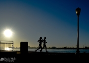 Two Joggers at Sunrise